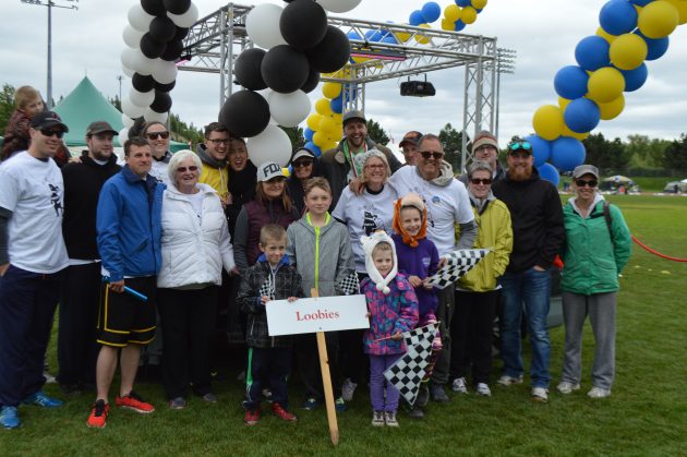 Team Loobies, with Colin Blondin (back row, yellow T-shirt) celebrate with smiles