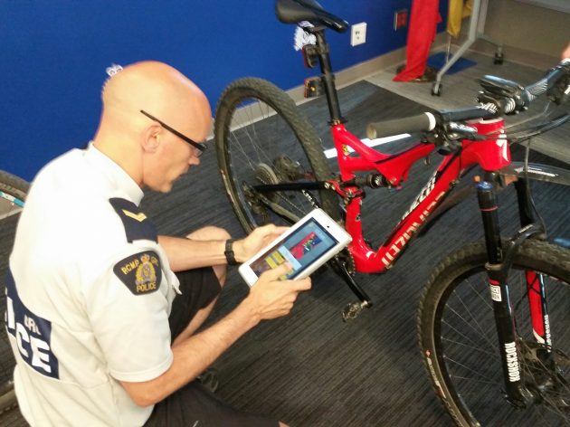 RCMP Corporal Craig Douglass demonstrates new app - photo 250News