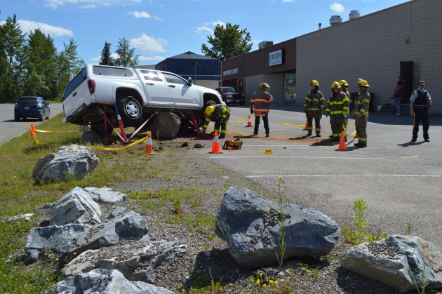 Elderly couple went to hospital after their truck ended up on top of boulder at Massey and Nicholson. Photos 250News