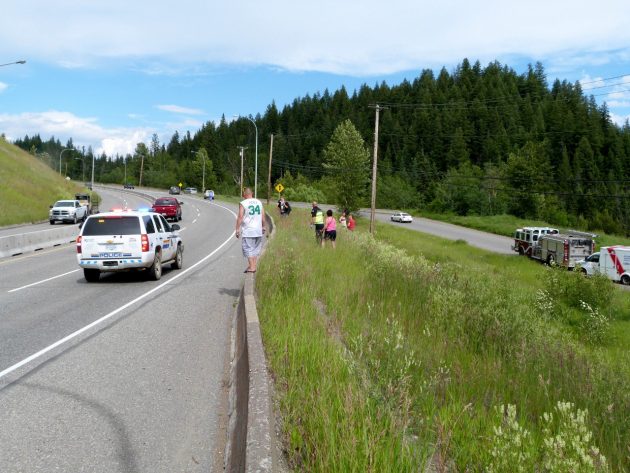 Emergency crew work on and below Hart Highway following motorcycle accident Sunday afternoon. Photos 250 News