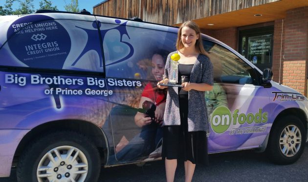 Cassie Lobban, operations and events assistant at BBBS PG, holds the great lemon trophy - photo 250News