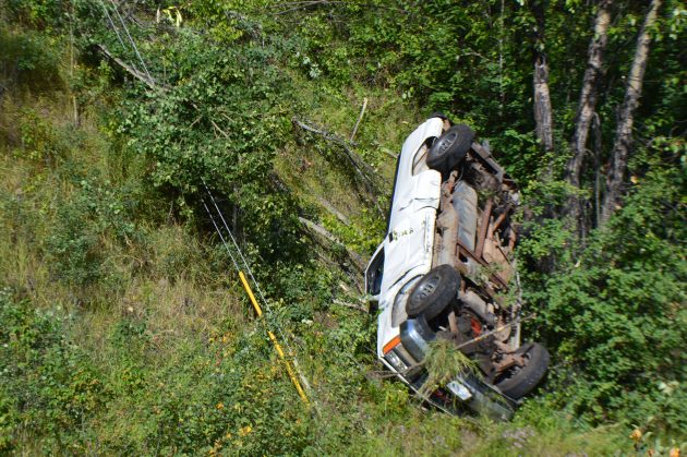 Truck rests on passenger side, leaving driver's window unblocked