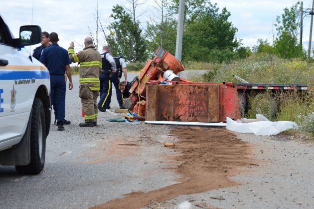 Trailer, welder and pump lay beside on-ramp to Highway 97 north on Saturday. Photo 250News