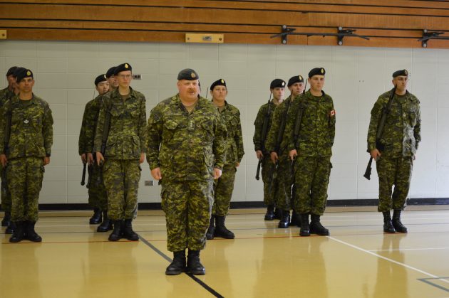 Captain Mike Oviatt and this year's basic military training graduates. Photos 250News