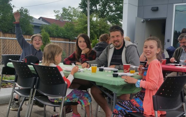 The Sims family enjoys breakfast