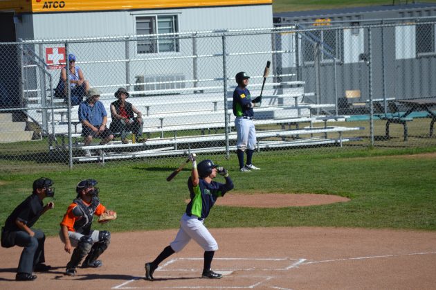 Roswell Invaders' Cody Bishop belts the first of his two home runs Saturday against the Kamloops Sun Devils. Photo 250News