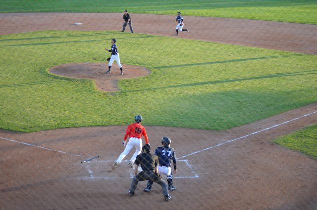 Team Japan pitcher Daiki Tajima and Sidearm Nation's Justin Johnston watch Johnston's 2nd inning grand slam sail toward the left field fence Friday night. Photo 250 News