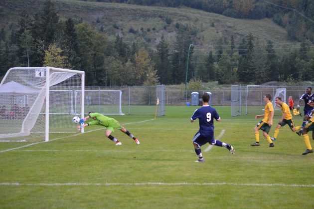 UNBC keeper Mitch MacFarlane makes spectacular save during first half of Timberwolves' home opener Friday night. Photo 250News