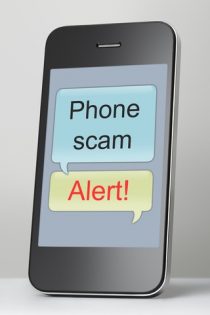 Mobile phone with scam text message speech bubble