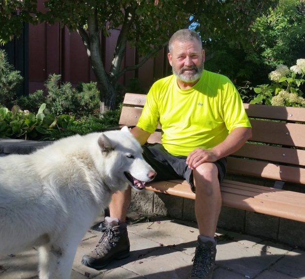 Brett Merchant and his dog Kura during a pit stop in Prince George Wednesday - photo 250News