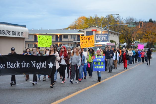 March to end violence against women proceeds along 7th Avenue Friday night. Photo 250News