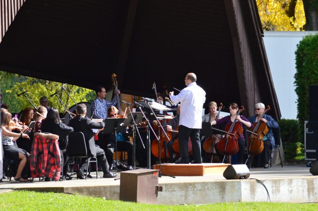 Jose Delgado-Guevara conducts the PGSO at Sunday's free Pops in the Park concert. Photos 250News