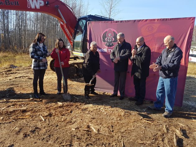Lheidli T'enneh Councillors, Prince George Mayor Lyn Hall, MP Todd Doherty and Regional District Chair Art Kaehn watch as Chief Frederick digs out the first shovel load of dirt - photo250News