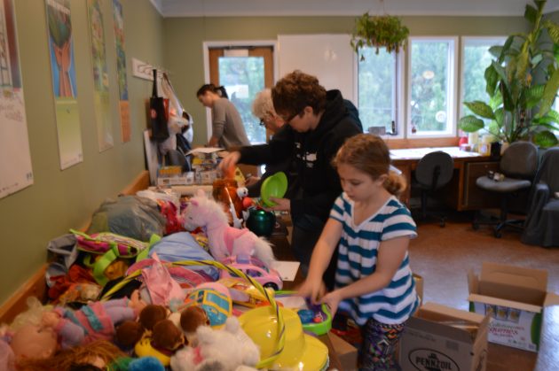 It was busy sorting through donated toys at the REAPS office on Saturday. Photo 250News