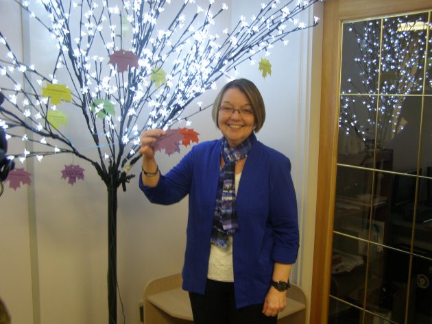 Prince George-Valemount MLA Shirley Bond reads a message from the diversity tree today at the Immigrant and Multicultural Services Society - photos 250News