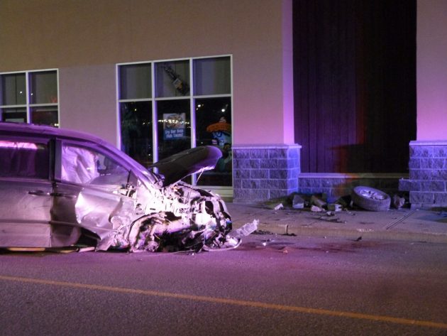There is substantial front-end damage to a van that hit a retail outlet in College Heights early Saturday.  Photo 250News
