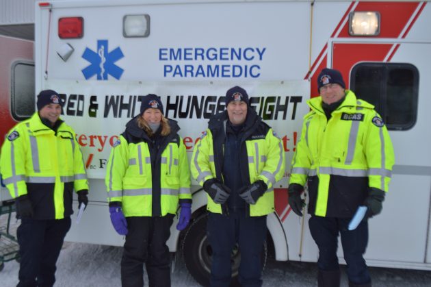 BC Ambulance staffers (l-r) Cory Davoren, Deb Standen, Shawn Morash and Rob Pritchard take food donations Saturday. Photos 250News
