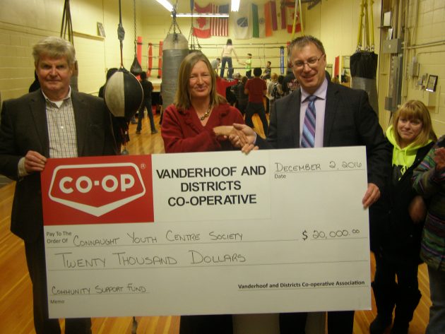 Bud Pye (left) and Allan Bieganski from Vanderhoof and Districts Co-op present a cheque worth $20,000 to Catharine Kendall, executive director, Connaught Youth Centre Society - photo 250News
