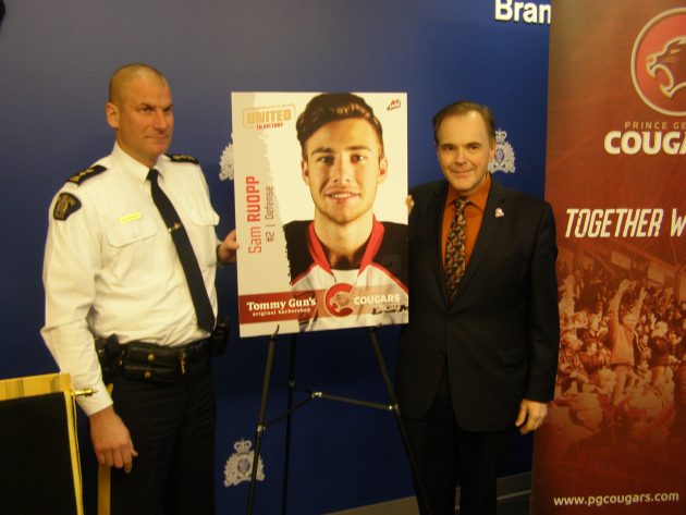 From left, RCMP Supt. Warren Brown and Prince George Cougars business v-p Andy Beesley - photo 250News